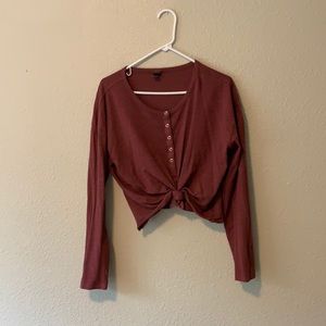 A long sleeve crop top with some button down
